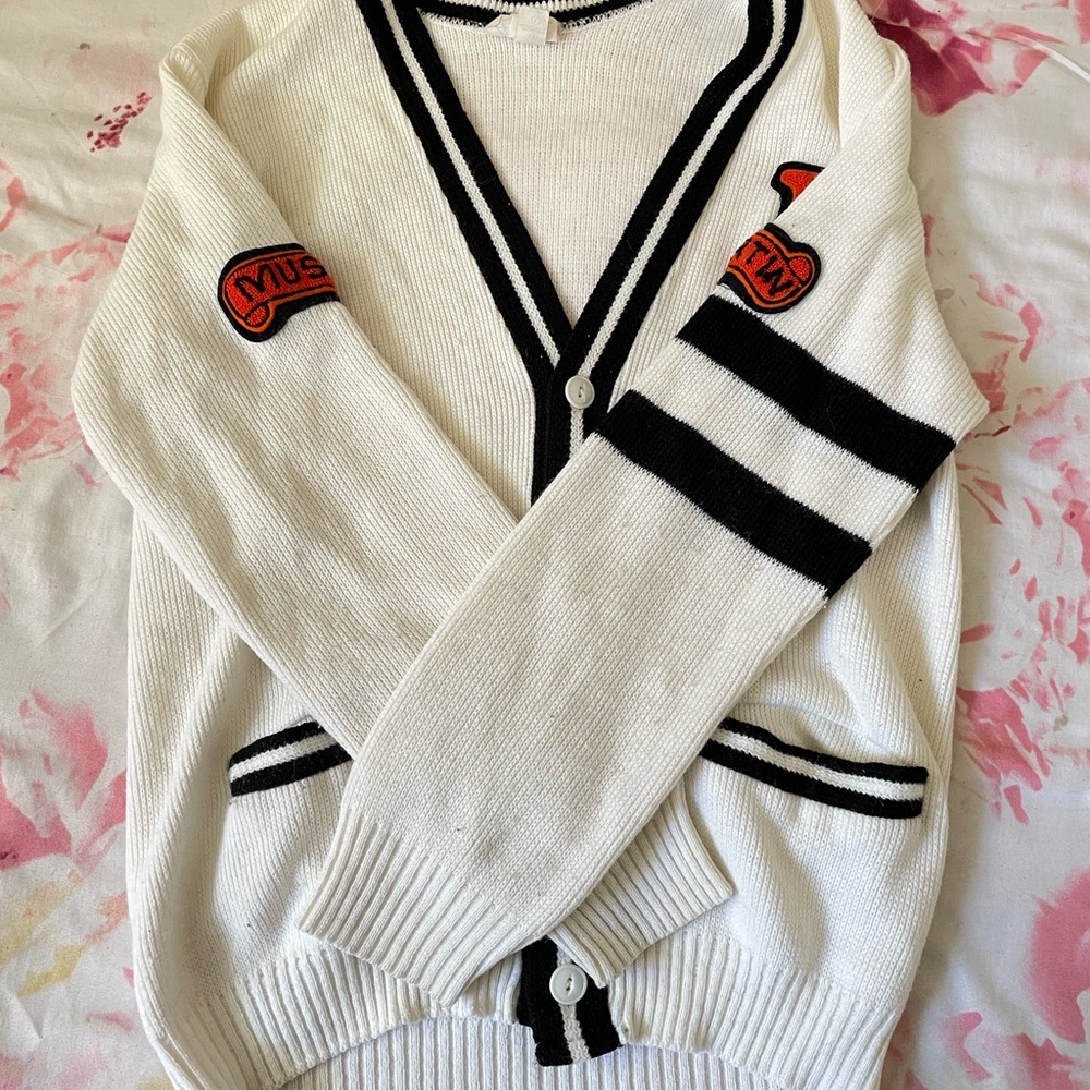 Size small cardigan with patches.